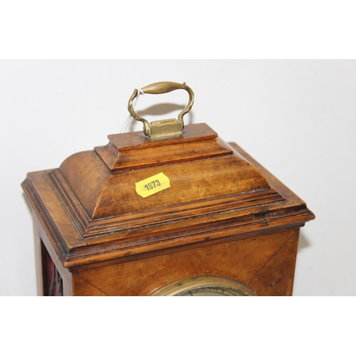 1319 - An early 20th century walnut cased bracket clock with fretwork panels, with pendulum but no key, Jap... 