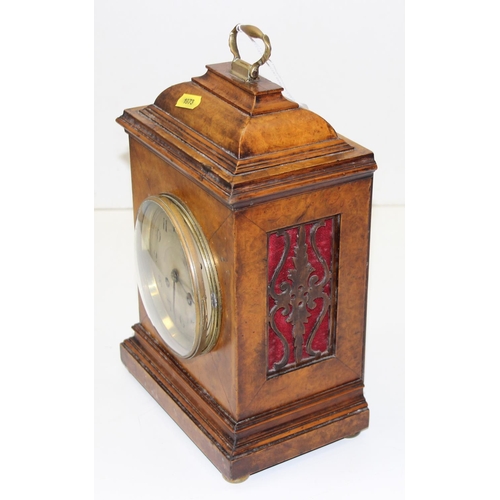 1319 - An early 20th century walnut cased bracket clock with fretwork panels, with pendulum but no key, Jap... 