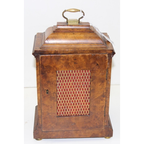 1319 - An early 20th century walnut cased bracket clock with fretwork panels, with pendulum but no key, Jap... 