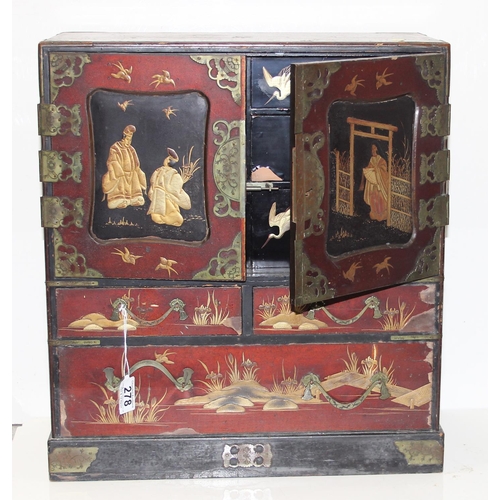 278 - An early 20th century Japanese lacquered table top cabinet, 2 short over one long drawer below 2 cab... 