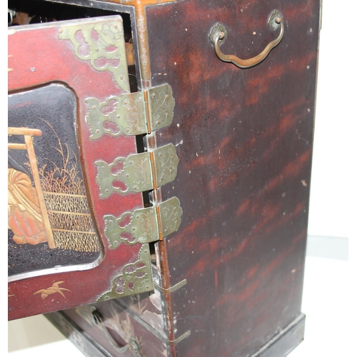 278 - An early 20th century Japanese lacquered table top cabinet, 2 short over one long drawer below 2 cab... 