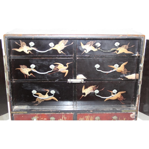 278 - An early 20th century Japanese lacquered table top cabinet, 2 short over one long drawer below 2 cab... 