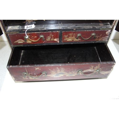 278 - An early 20th century Japanese lacquered table top cabinet, 2 short over one long drawer below 2 cab... 