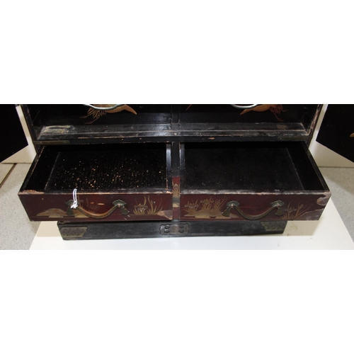 278 - An early 20th century Japanese lacquered table top cabinet, 2 short over one long drawer below 2 cab... 