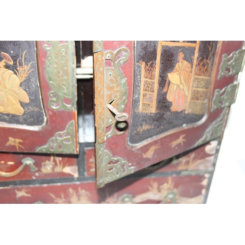 278 - An early 20th century Japanese lacquered table top cabinet, 2 short over one long drawer below 2 cab... 