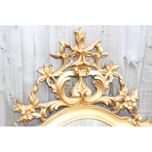 371 - An extremely large Rococo style wall mirror with pierced gilt frame, approx 143cm x 80cm