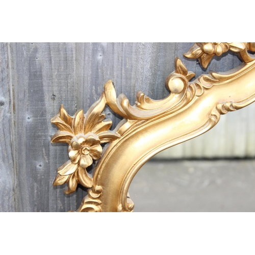 371 - An extremely large Rococo style wall mirror with pierced gilt frame, approx 143cm x 80cm