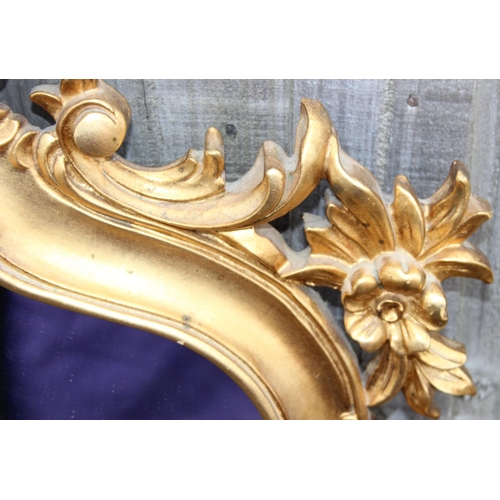 371 - An extremely large Rococo style wall mirror with pierced gilt frame, approx 143cm x 80cm