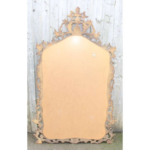 371 - An extremely large Rococo style wall mirror with pierced gilt frame, approx 143cm x 80cm