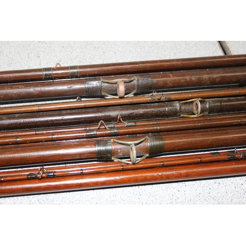 704 - Qty of vintage fishing rods to include 4 interesting C Farlow Hold Fast fishing rods, some with inte... 