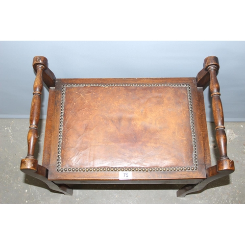 75 - An early 20th century lift top piano stool with studded leather top