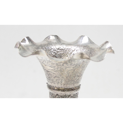 1043 - An Indian silver vase with embossed decoration and flared rim, XRF tested approx 93% pure, approx 21... 