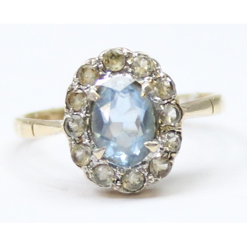 1139 - 9ct gold floral set with central light blue stone surrounded by white stones, approx size Q, approx ... 