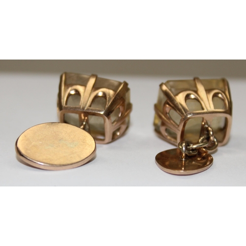 1143 - A pair of impressive 9ct gold mounted cufflinks with cut stones, marked 9k and XRF confirmed as 9ct ... 