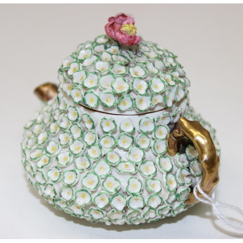 1634 - An extremely rare Rockingham squat pear shaped miniature teapot and cover, encrusted with florets an... 