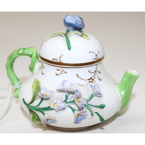 1635 - An extremely rare 19th century squat pear shaped miniature teapot and cover, likely by Rockingham bu... 