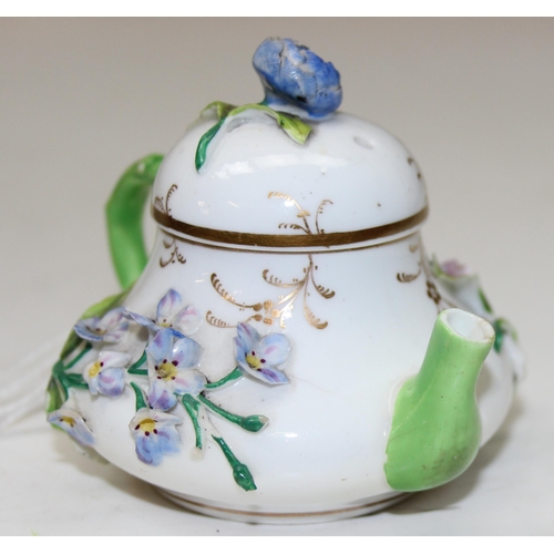 1635 - An extremely rare 19th century squat pear shaped miniature teapot and cover, likely by Rockingham bu... 