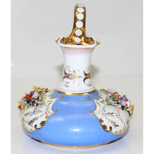 1647 - An early 19th century Bloor Derby porcelain jug encrusted with flowers on a blue ground with gilt hi... 