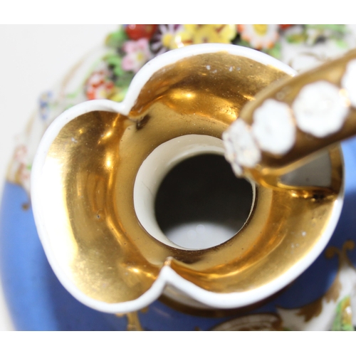 1647 - An early 19th century Bloor Derby porcelain jug encrusted with flowers on a blue ground with gilt hi... 