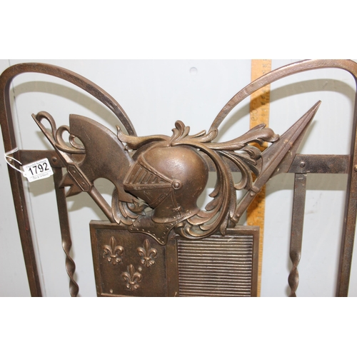 1792 - A decorative wrought iron heraldic fire guard