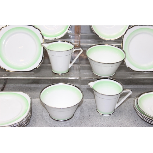 1799 - An Art Deco period tea set with chrome edging by Bell Bone China