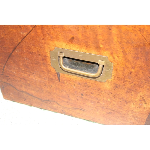 284 - An antique walnut writing and travelling vanity box with various compartments, hidden drawer and cam... 