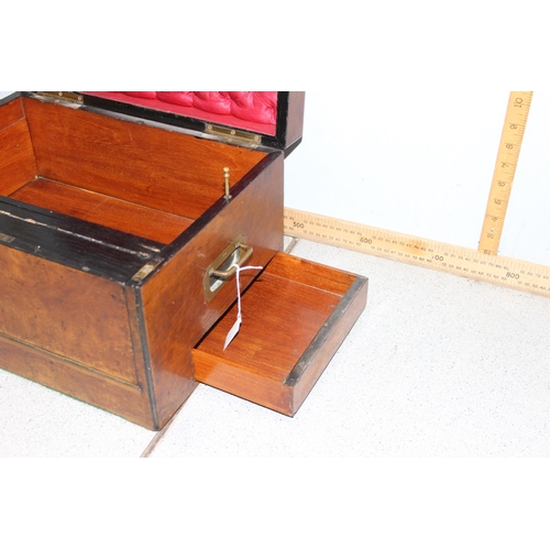 284 - An antique walnut writing and travelling vanity box with various compartments, hidden drawer and cam... 