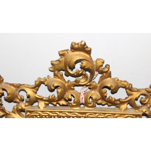 391 - An antique Rococo style gilt brass framed mirror decorated with acanthus scrolls, approx 40cm x 30cm... 