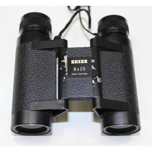 659 - A pair of small Carl Zeiss 8x20 folding binoculars in leather case