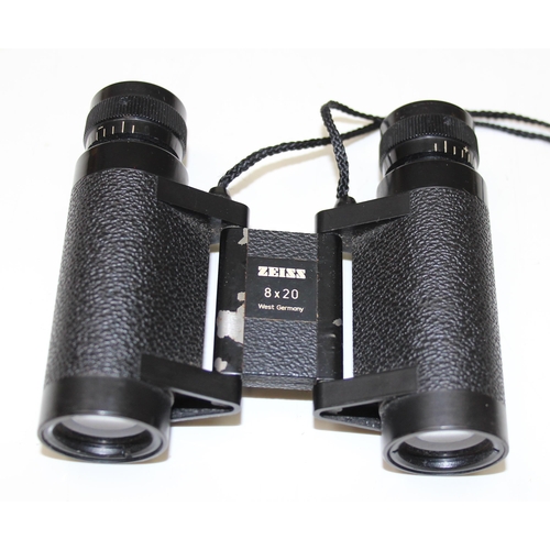 659 - A pair of small Carl Zeiss 8x20 folding binoculars in leather case