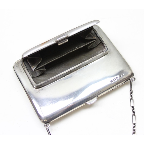 1001 - An early 20th century silver combination coin purse and aide memoire with leather interior and silve... 