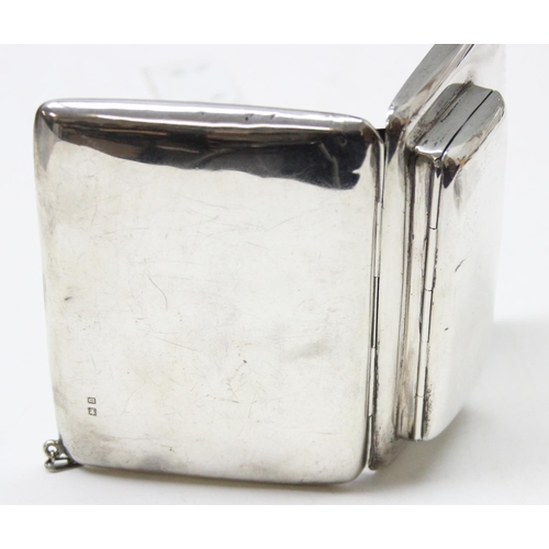 1001 - An early 20th century silver combination coin purse and aide memoire with leather interior and silve... 