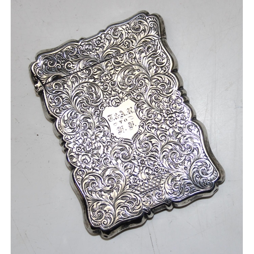 1004 - A 19th century silver card case with engraved acanthus scrolls decoration, Birmingham 1853 or 1854 b... 