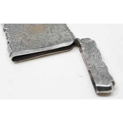 1004 - A 19th century silver card case with engraved acanthus scrolls decoration, Birmingham 1853 or 1854 b... 