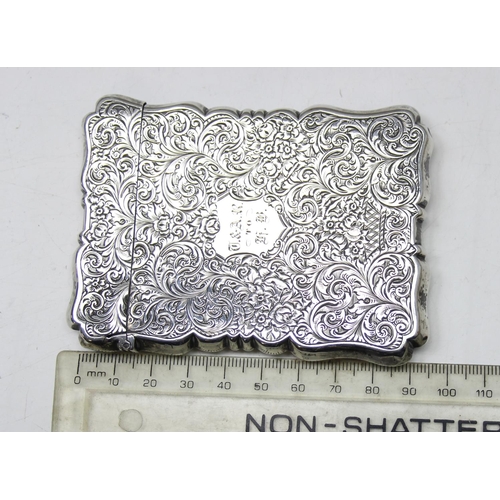 1004 - A 19th century silver card case with engraved acanthus scrolls decoration, Birmingham 1853 or 1854 b... 