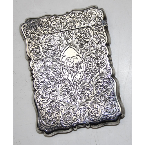 1004 - A 19th century silver card case with engraved acanthus scrolls decoration, Birmingham 1853 or 1854 b... 