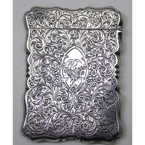 1004 - A 19th century silver card case with engraved acanthus scrolls decoration, Birmingham 1853 or 1854 b... 