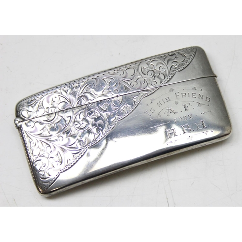 1007 - An antique silver card case of slightly curved form with engraved decoration, Birmingham 1904 by Jon... 