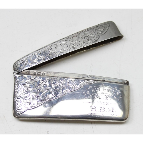 1007 - An antique silver card case of slightly curved form with engraved decoration, Birmingham 1904 by Jon... 