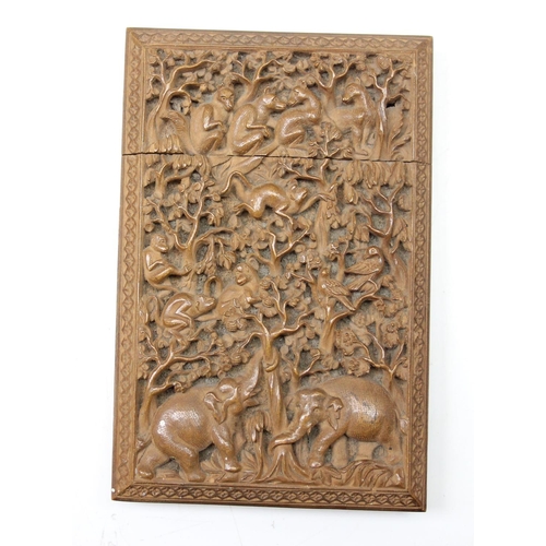 1011 - An unusual antique carved sandalwood card case depicting a variety of animals within a jungle scene,... 