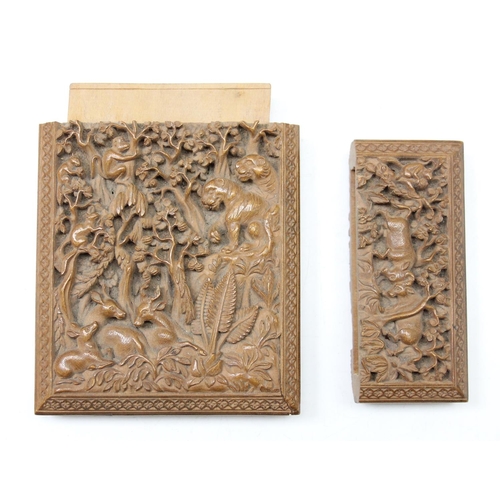 1011 - An unusual antique carved sandalwood card case depicting a variety of animals within a jungle scene,... 