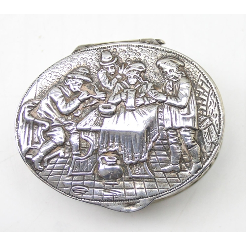 1013 - An antique Dutch 930 silver tobacco or snuff box decorated with an embossed tavern scene, marks to b... 