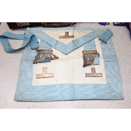 1405 - Masonic case and contents mainly related to the Khyber Lodge, to inc 2 aprons, various books, sash 4... 