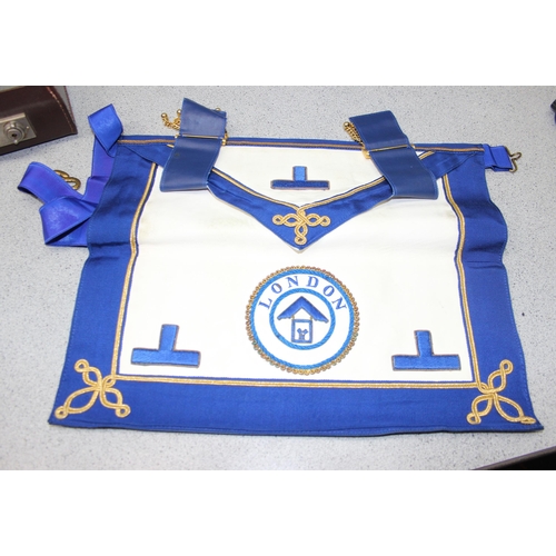 1405 - Masonic case and contents mainly related to the Khyber Lodge, to inc 2 aprons, various books, sash 4... 