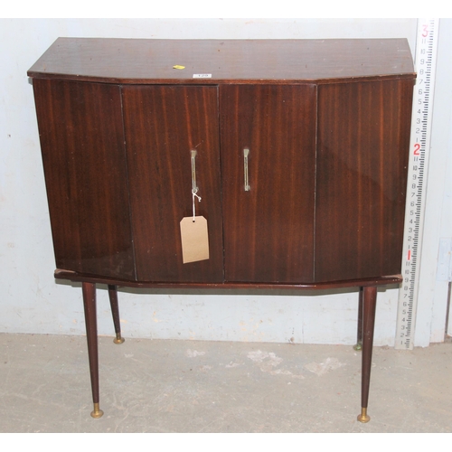 114 - Mid-century polished bi-folding door cupboard on legs with a light oak legate coffee table (2), cupb... 