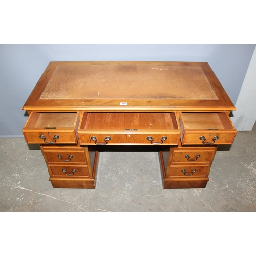 100 - Reproduction yew wood leather topped pedestal desk, approx width 120cm