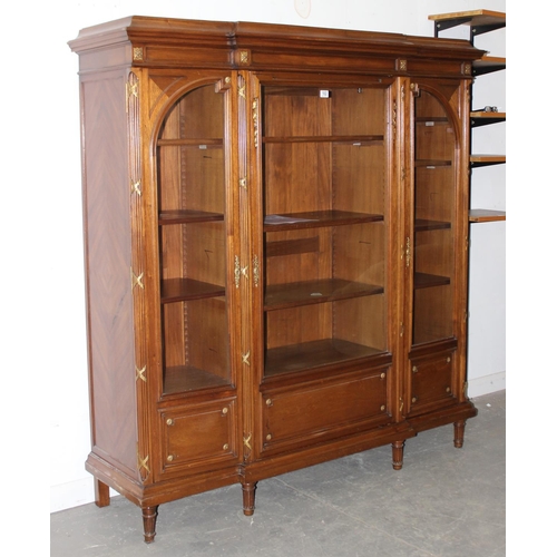 102 - A Late 19th or early 20th century French solid walnut glazed bookcase by Alexandre Hugnet of Paris, ... 