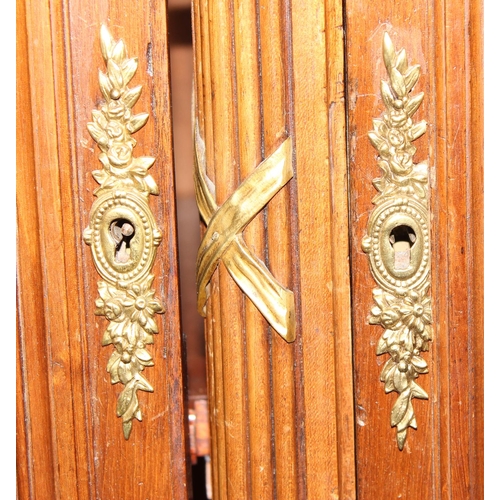 102 - A Late 19th or early 20th century French solid walnut glazed bookcase by Alexandre Hugnet of Paris, ... 