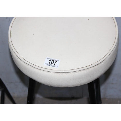 107 - Pair of vintage style bar stool with black metal legs & cream leatherette seats, approx height 66cm