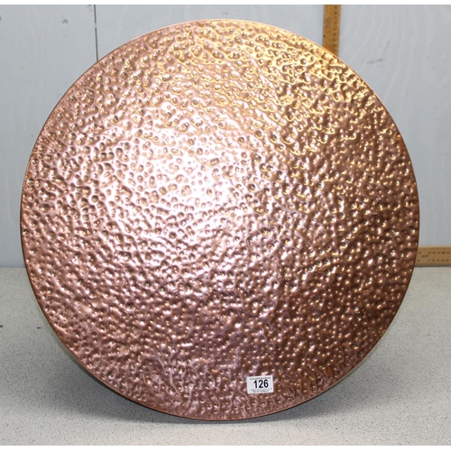 126 - Circular coffee table with hammered copper top, approx width 60cm